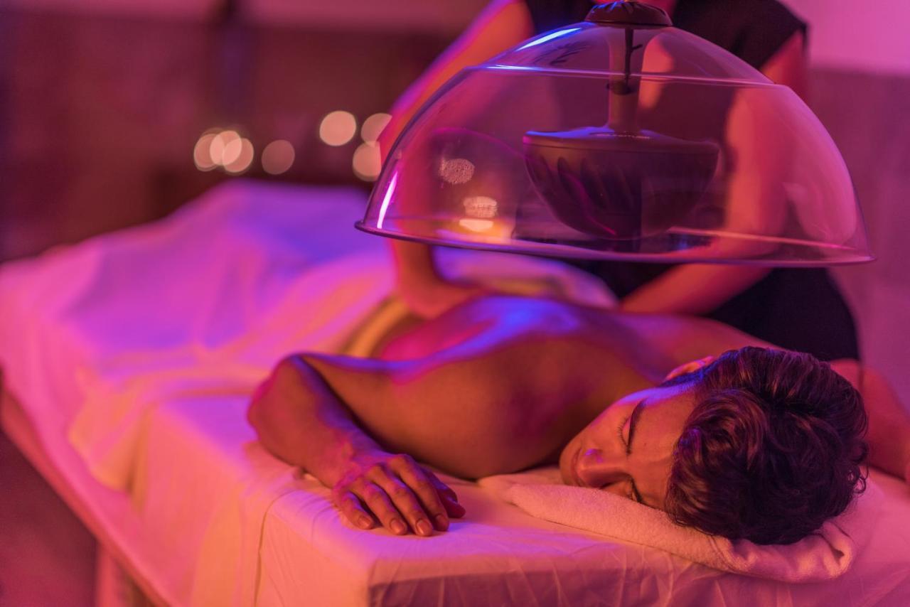 Hard Rock Hotel Goa Calangute Esterno foto A patient receiving a cupping treatment